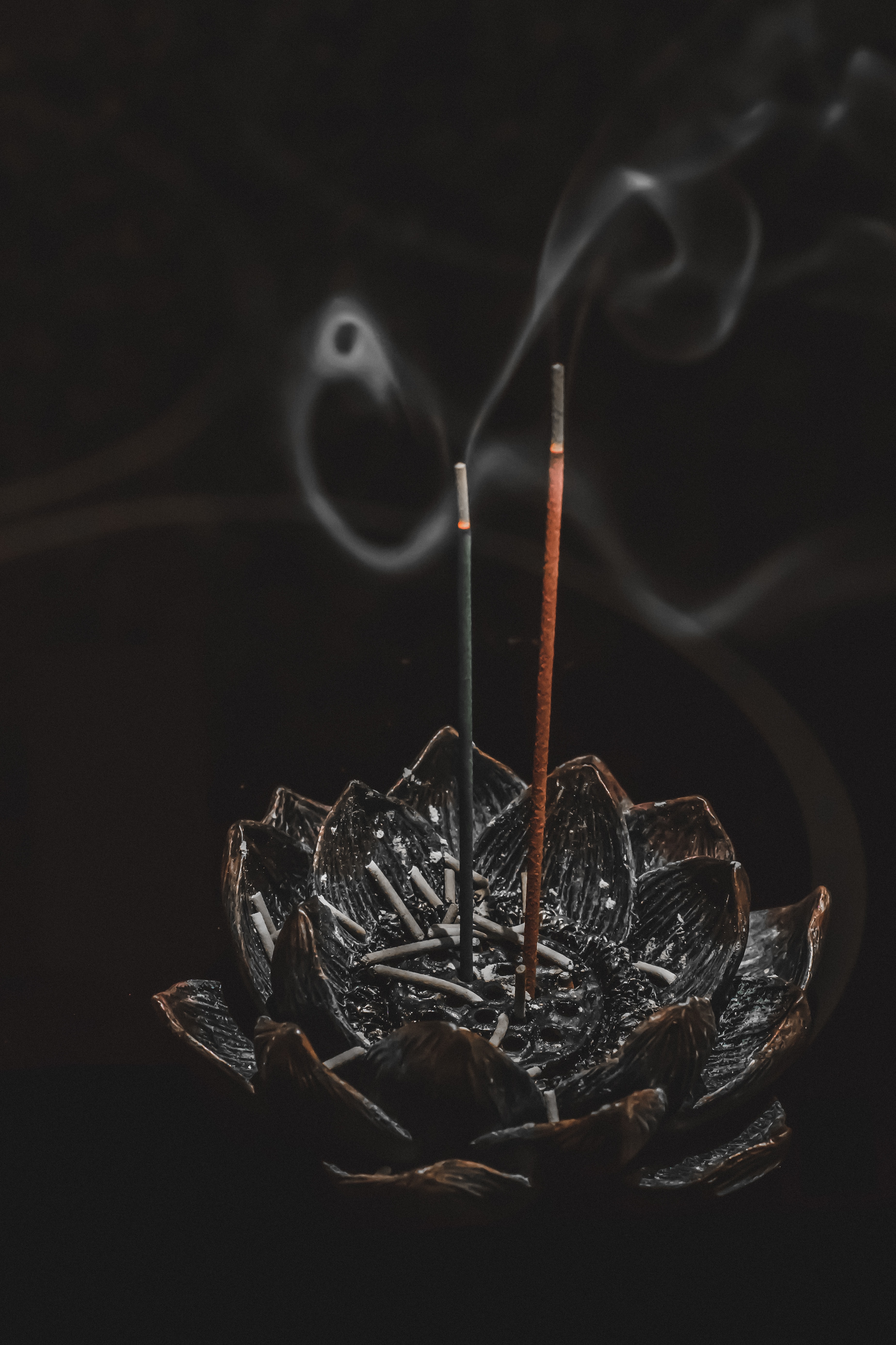 an image of incense sticks burning