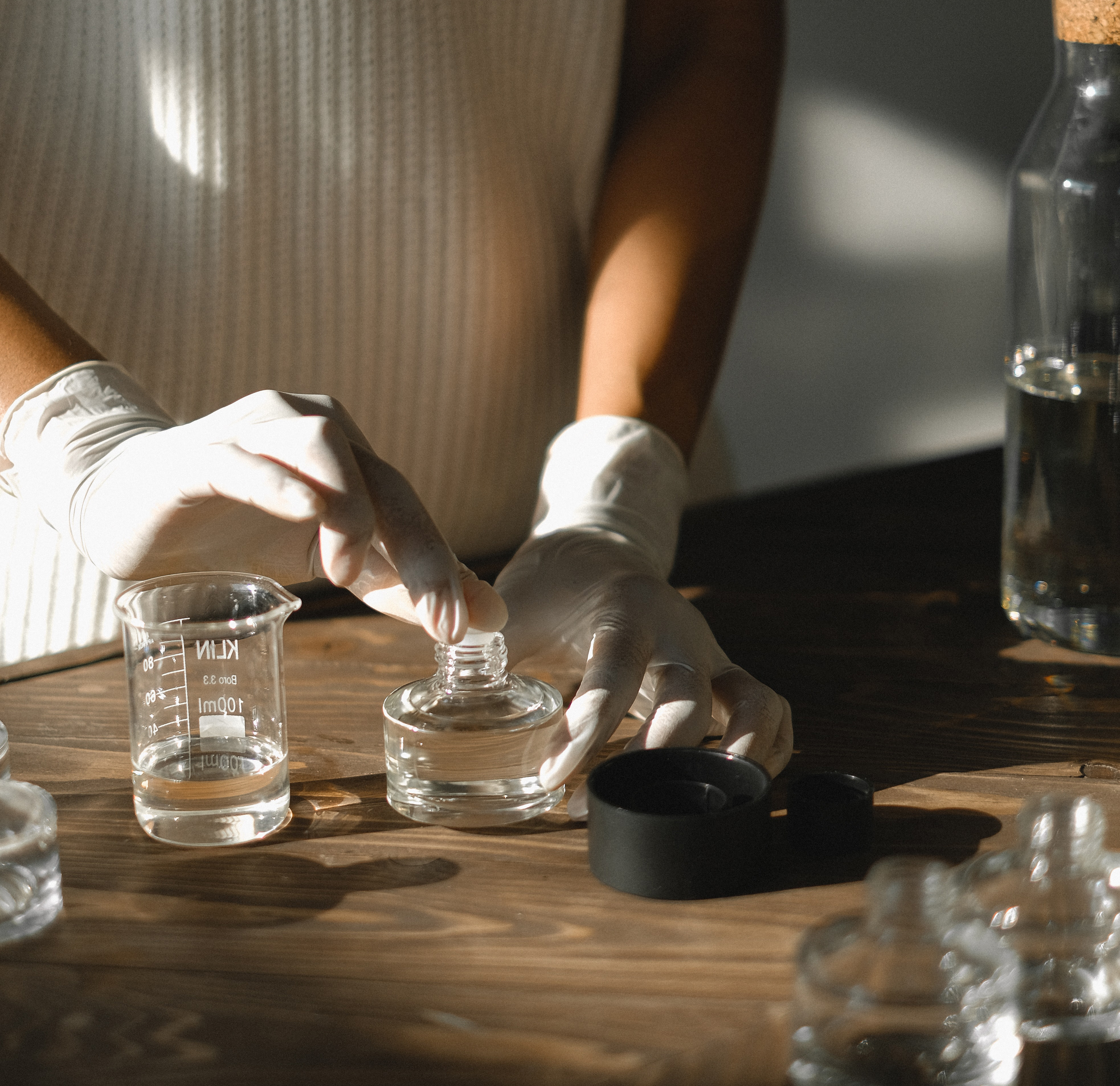 a photograph of someone making perfume